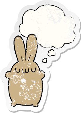 Düşünce baloncuğu olan çizgi film tavşanı insan tarafından çizilmiş yıpranmış bir çıkartma.