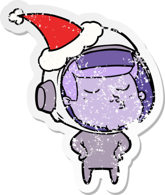 Bir insan tarafından çizilmiş Noel Baba şapkası giyen kendine güvenen bir astronotun sıkıntılı çıkartması.