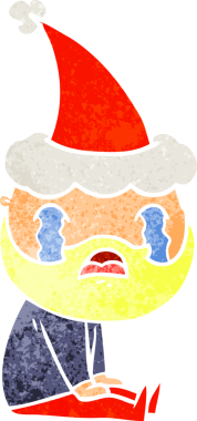 Bir insan tarafından çizilmiş Noel Baba şapkasıyla ağlayan sakallı bir adamın eski çizgi filmi.