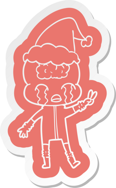 Büyük beyinli bir uzaylının ağlayan ve Noel Baba şapkası takarak barış işareti veren garip bir çizgi film çıkartması.