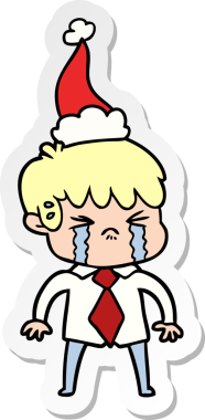 Bir insan tarafından çizilmiş Noel Baba şapkasıyla ağlayan bir çocuğun el yazısı.