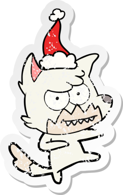 Bir insan tarafından çizilmiş sırıtan Noel Baba şapkası giymiş bir tilkinin el çizimi.