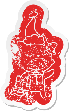 Noel hediyesi olan bir kedinin insan tarafından çizilmiş Noel Baba şapkası giymesi garip bir karikatür.