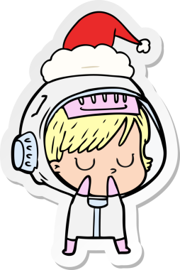 Bir insan tarafından çizilmiş Noel Baba şapkası giyen astronot bir kadının el yazısı.