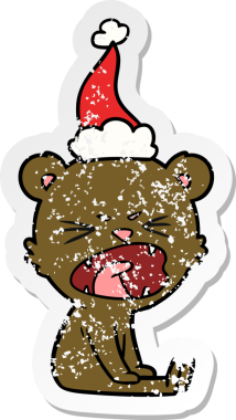 Kızgın el, insan tarafından çizilmiş Noel Baba şapkası takan bir ayı çıkartması çizmiş.