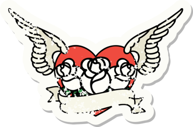 Geleneksel bir stil olan, çiçek ve pankart çizilmiş uçan kalp dövmesi.