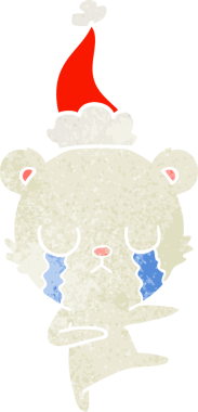 Ağlayan kutup ayısı eli bir insanın çizdiği Noel Baba şapkasının eski çizgi filmini çizdi.