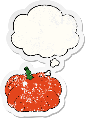 Düşünce baloncuğu olan karikatür balkabağı insan tarafından çizilmiş yıpranmış bir çıkartma.