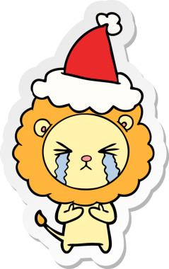 Ağlayan bir aslanın insan tarafından çizilmiş Noel Baba şapkası taktığı el yazısı.