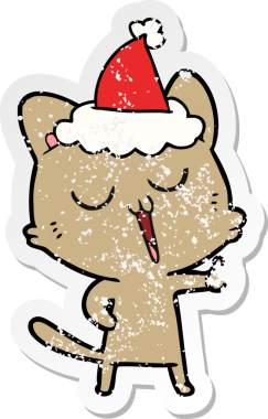 Bir insan tarafından çizilmiş Noel Baba şapkasıyla şarkı söyleyen bir kedinin el yazısı.