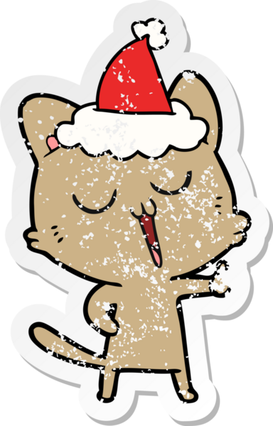 Bir insan tarafından çizilmiş Noel Baba şapkasıyla şarkı söyleyen bir kedinin el yazısı.