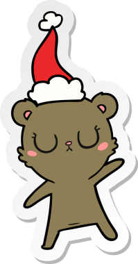 Bir insan tarafından çizilmiş Noel Baba şapkası takan bir ayının barışçıl el yazısı.