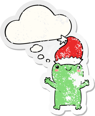 Düşünce baloncuğu olan şirin noel kurbağası insan tarafından çizilmiş yıpranmış bir çıkartma.