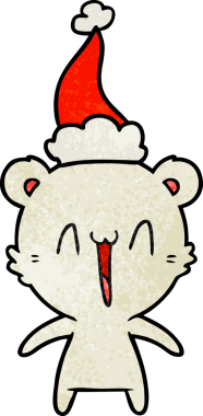 Mutlu kutup ayısı eli bir insan tarafından çizilmiş Noel Baba şapkası.