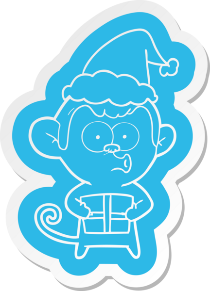 Bir insan tarafından çizilmiş Noel Baba şapkası giyen bir maymunun garip çizgi film çıkartması.