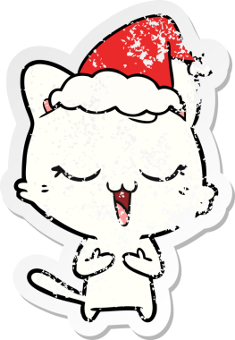 Mutlu el çizilmiş hüzünlü bir karikatür. Bir insan tarafından çizilmiş Noel Baba şapkası takan bir kedi.