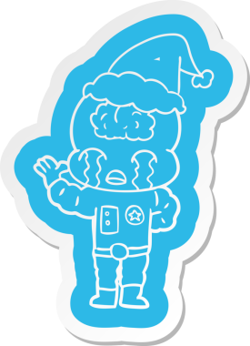 Bir insan tarafından çizilmiş Noel Baba şapkasıyla ağlayan büyük beyinli bir uzaylının garip çizgi film etiketi.