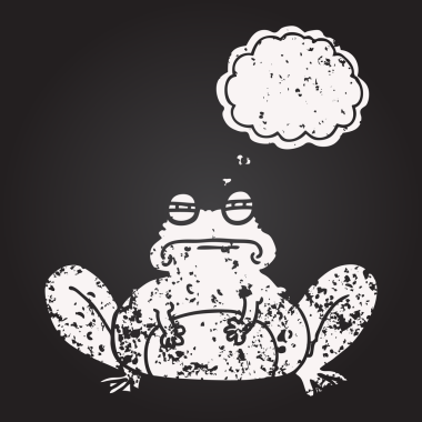 Tahta tebeşirle insan tarafından çizilmiş düşünce balonu karikatürü kurbağası.