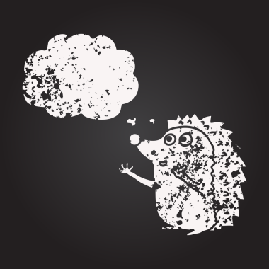 Kara tahta tebeşirle çizilmiş düşünce balonu çizgi filmi şirin kirpi bir insan tarafından çizilmiş.