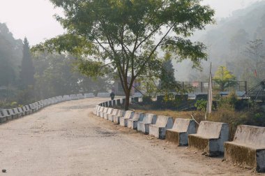 Empty road leading through on mountain forest background.Tabakoshi West Bengal India