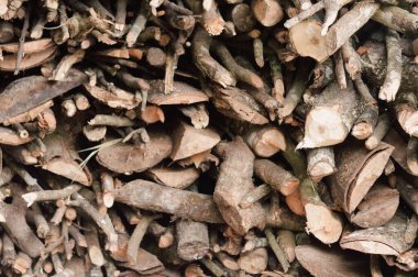 Stack of chopped firewood abstract background.