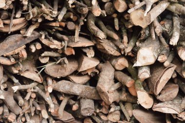 Stack of chopped firewood abstract background.