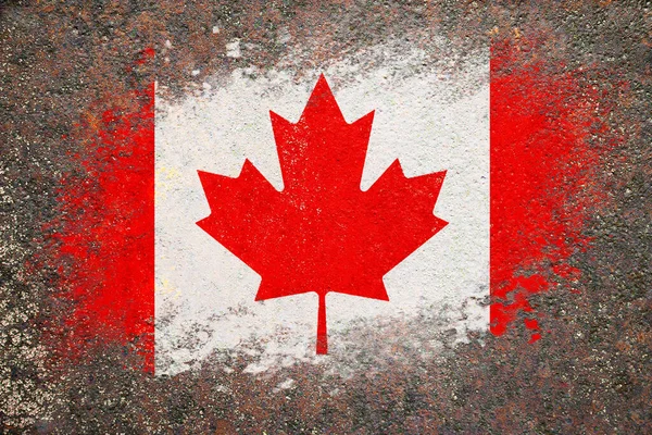 Flag of Canada. Flag is painted on a rusty surface. Rusty background. Creative background