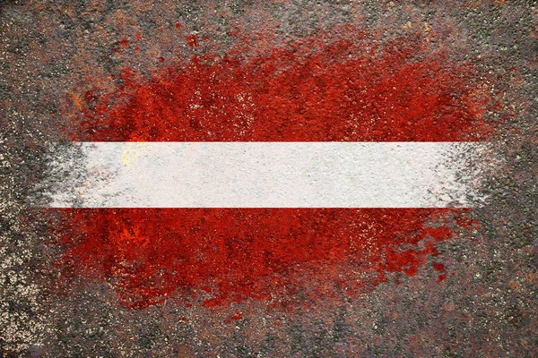 拉脱维亚国旗 国旗涂在生锈的表面上 生锈的背景创意背景 — 图库照片