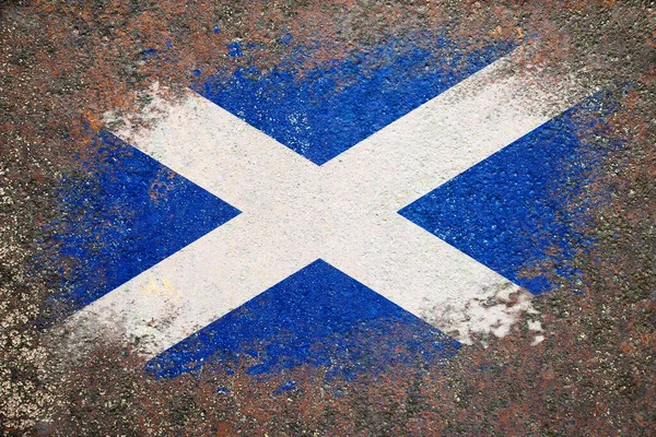 Flag of Scotland. Flag is painted on a rusty surface. Rusty background. Creative background