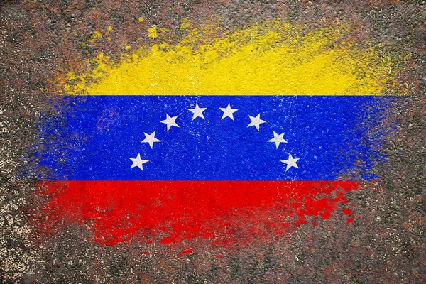 Flag of Venezuela. Flag is painted on a rusty surface. Rusty background. Creative background