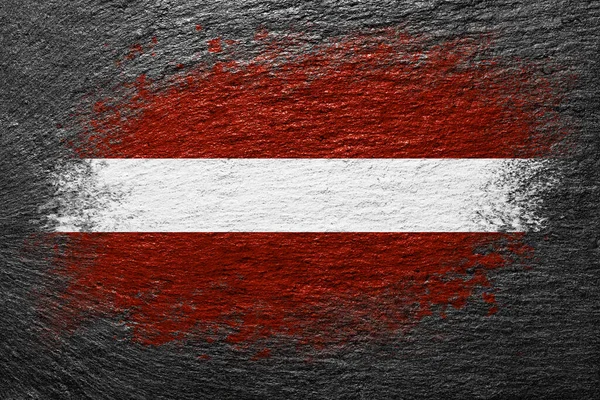 Lettország Zászlója Zászló Kőfelületre Van Festve Háttér Fekete Pala Háttér — Stock Fotó