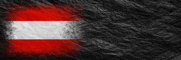 Flag of Austria. Flag is painted on black crumpled paper. Paper background. Copy space. Textured creative background