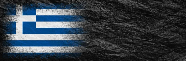 Flag of Greece. Flag is painted on black crumpled paper. Paper background. Copy space. Textured creative background