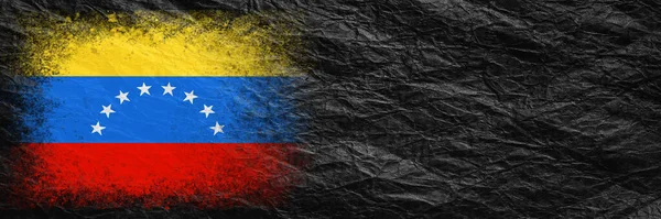Flag of Venezuela. Flag is painted on black crumpled paper. Paper background. Copy space. Textured creative background