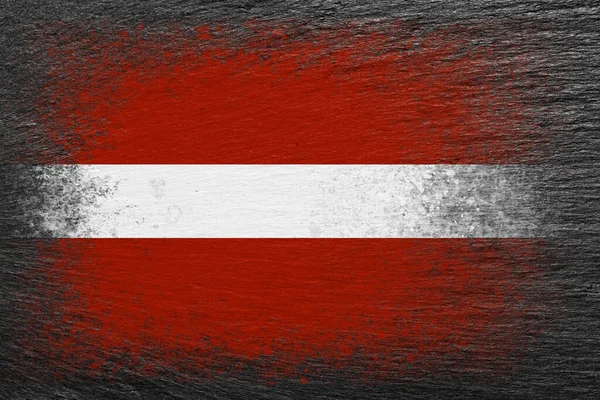 Lettország Zászlója Zászló Fekete Palakőre Van Festve Háttér Texturált Kreatív — Stock Fotó