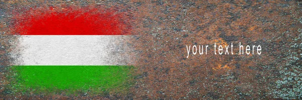 Flag of Hungary. Flag painted on rusty surface. Rusty background. Space for text. Textured creative background