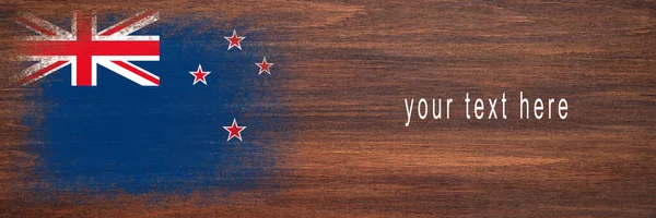 stock image Flag of New Zealand. Flag is painted on a wooden surface. Wooden background. Plywood surface. Copy space. Textured creative background