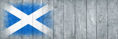 İskoçya bayrağı. Bayrak gri tahta bir yüzeye boyanmıştır. Ahşap arka plan. Hollywood yüzeyi. Uzayı kopyala Yapılandırılmış yaratıcı arkaplan