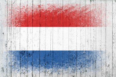 Hollanda bayrakları. Bayrak beyaz ahşap bir yüzeye boyanmıştır. Ahşap arka plan. Hollywood yüzeyi. Uzayı kopyala Yapılandırılmış yaratıcı arkaplan