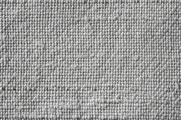 Fabric texture. Canvas background. The texture of a rough gray cloth. Macro image from canvas pattern