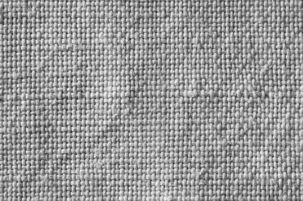 Canvas background. Fabric texture. Texture of a rough gray fabric. Macro image from canvas pattern