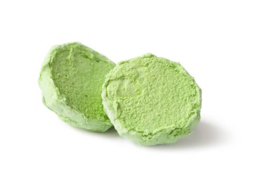 Marshmallows on white. Green marshmallow isolated on white background. Two halves of marshmallows. Colored sweetness