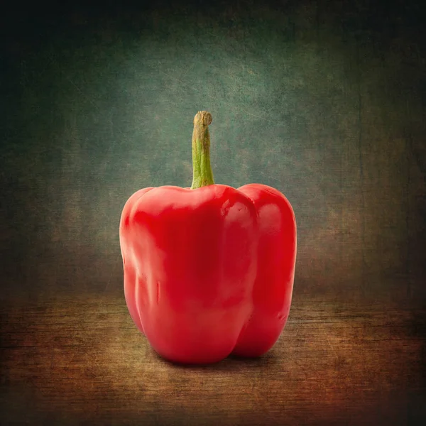 Red bell pepper. Red pepper on a dark abstract background. Grunge textured background. One bell pepper