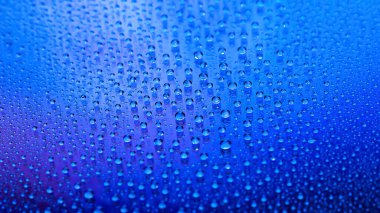 Water drops. Abstract gradient backdrop. Drop texture. Blue gradient. Highly textured image. Shallow depth of field. Selective soft focus