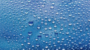 Water drops. Abstract gradient background. Drop texture. Dark blue gradient. Highly textured image. Shallow depth of field. Selective soft focus