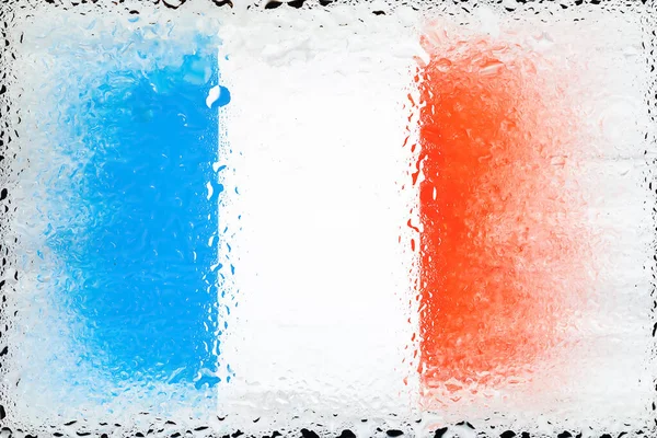 France flag. Flag of France on the background of water drops. Flag with raindrops. Splashes on glass. Abstract background