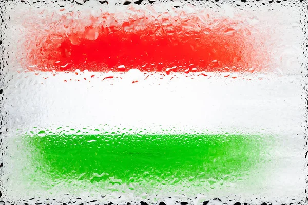 Hungary flag. Flag of Hungary on the background of water drops. Flag with raindrops. Splashes on glass. Abstract background