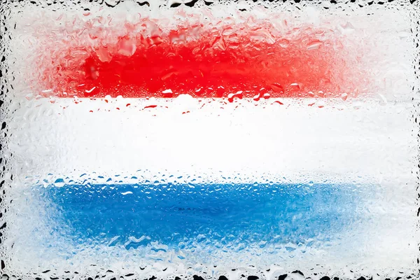 Netherlands flag. Flag of Netherlands on the background of water drops. Flag with raindrops. Splashes on glass. Abstract background