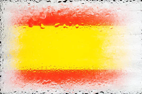 Spain flag. Flag of Spain on the background of water drops. Flag with raindrops. Splashes on glass. Abstract background