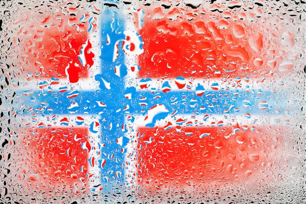 Flag of Norway. Norway flag on the background of water drops. Flag with raindrops. Splashes on glass. Abstract background
